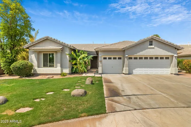 a house view with a play ground in front of it