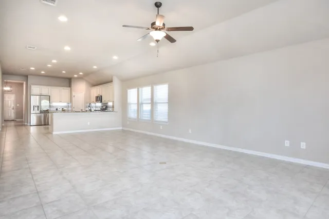 a view of a kitchen with a sink and a stove top oven