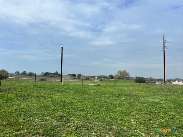 a view of a golf course with a lake