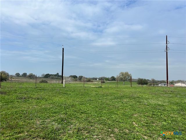 a view of a golf course with a lake