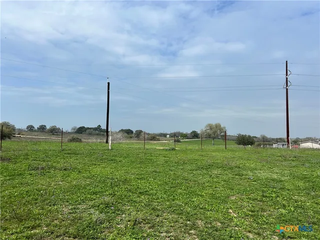 a view of a golf course with a lake