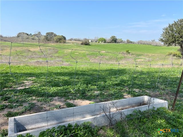 a view of a lake with a big yard