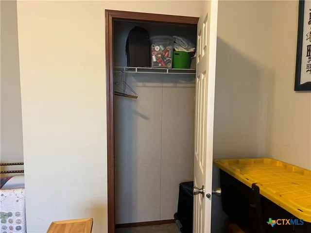 a view of a bedroom from a hallway