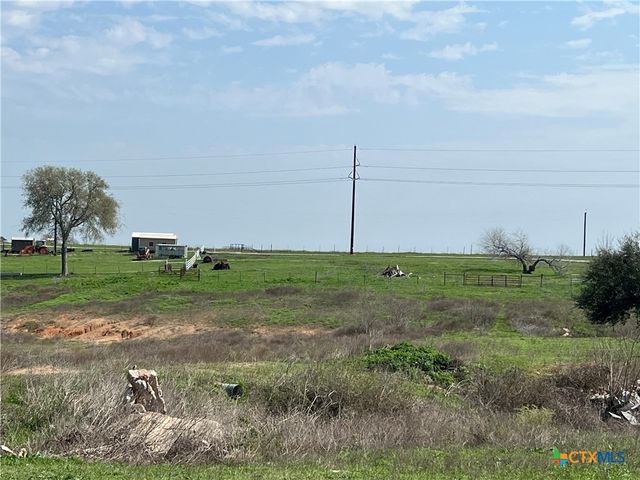 a view of a bench in a field