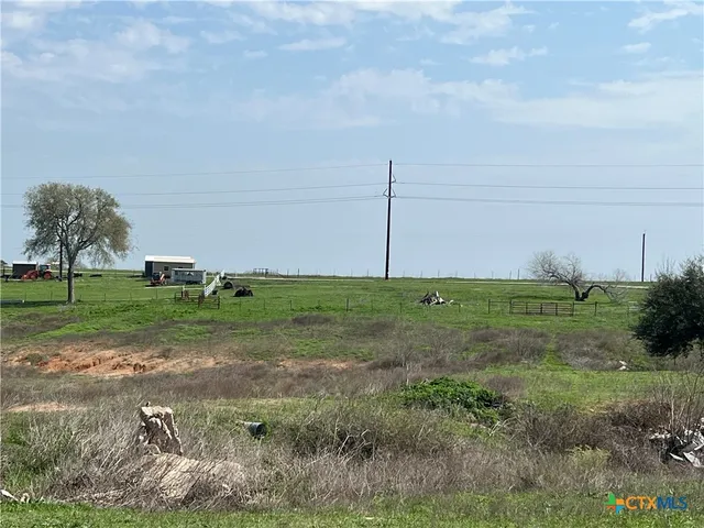a view of a bench in a field