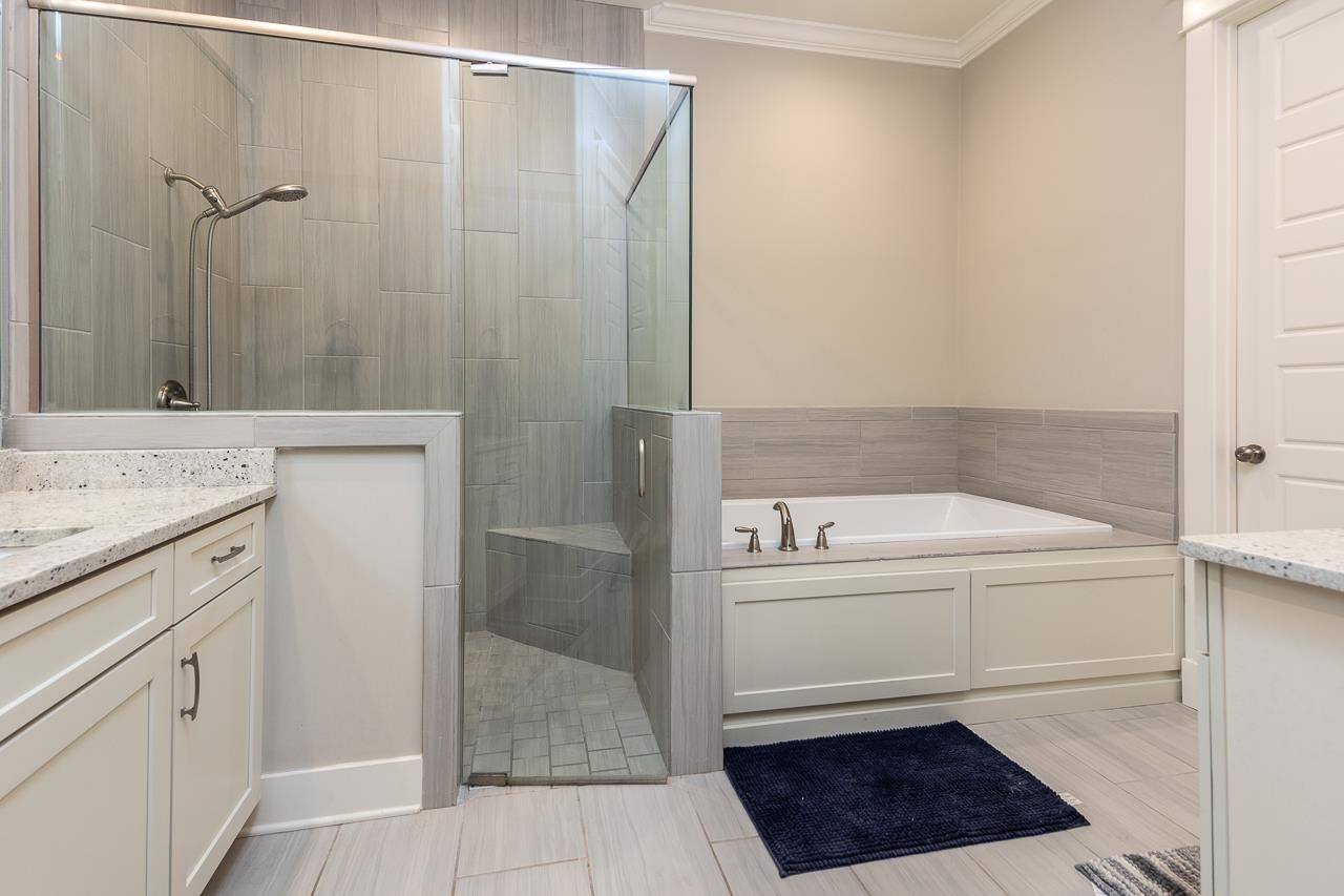458 South Shea Road Collierville, TN 38017 - Photo 19 of 27 Bathroom featuring vanity, ornamental molding, and plus walk in shower