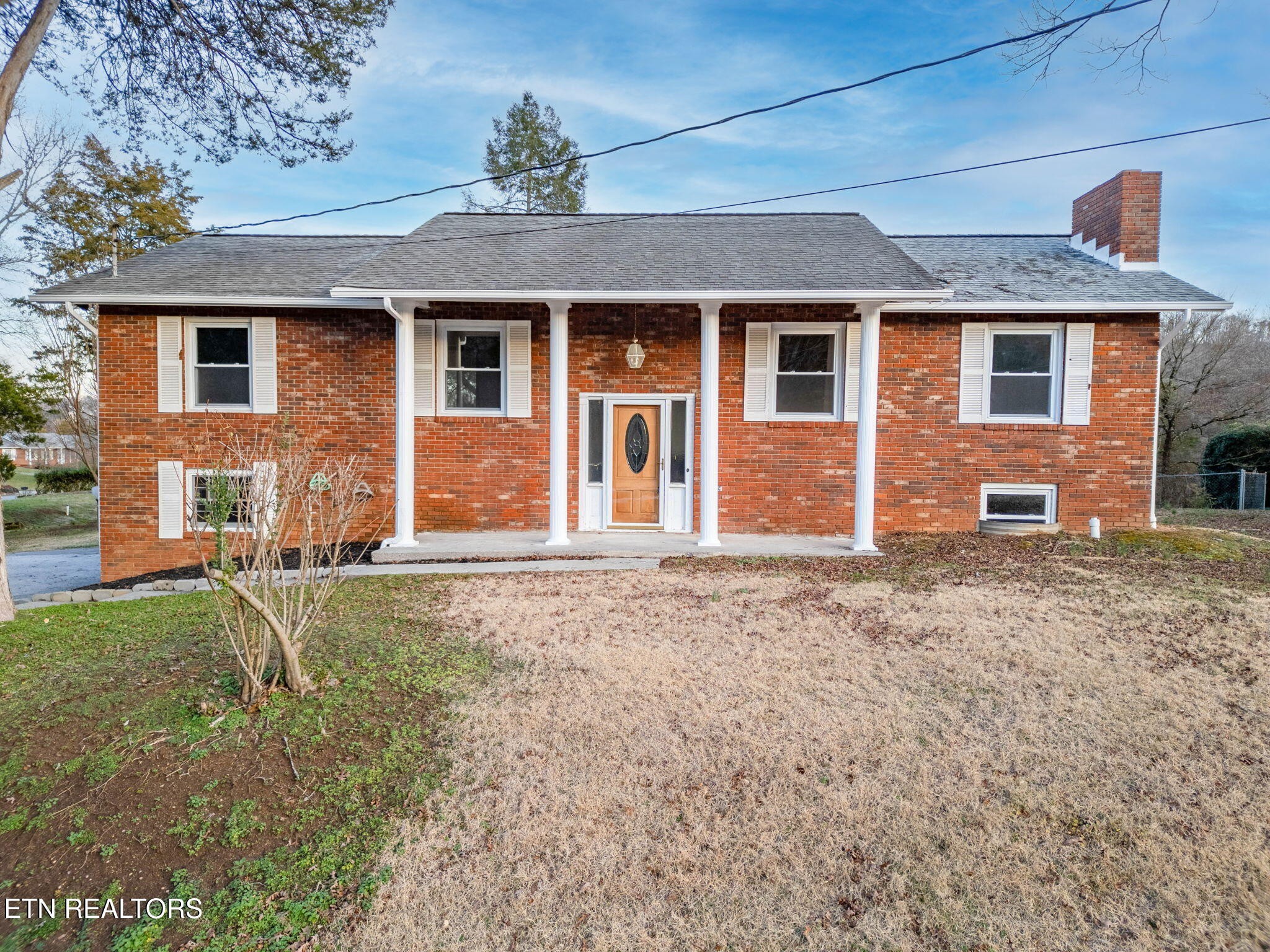 front view of a house with a yard