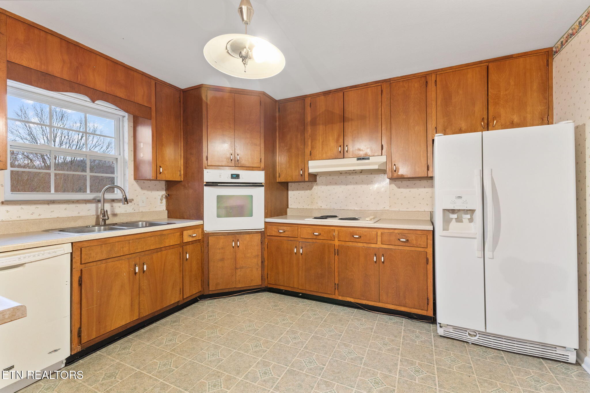 101 Albright Road Oak Ridge, TN 37830 - Photo 13 of 37 a kitchen with stainless steel appliances granite countertop a refrigerator a sink dishwasher a stove and a refrigerator with wooden cabinets