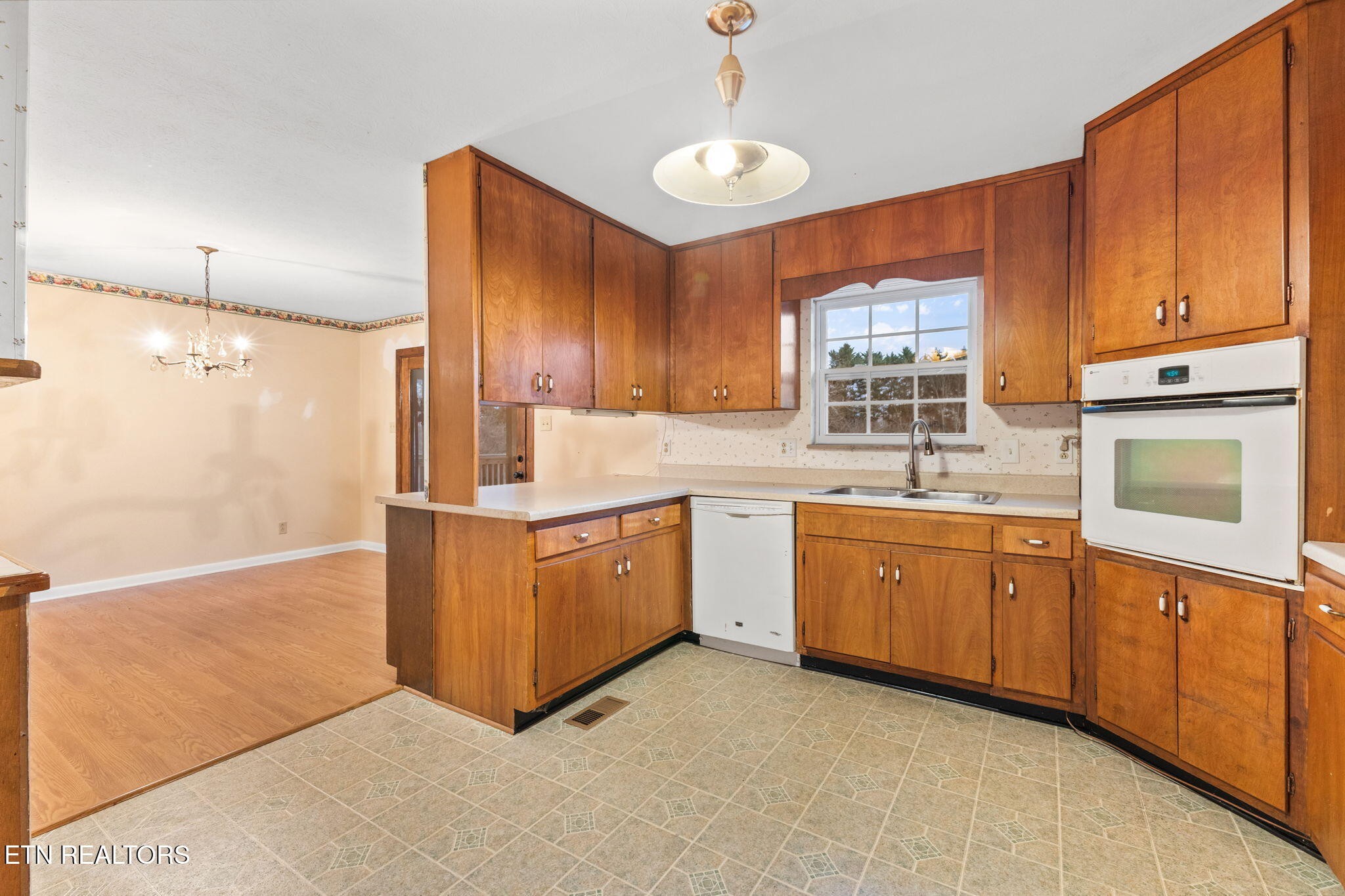 101 Albright Road Oak Ridge, TN 37830 - Photo 14 of 37 a kitchen with stainless steel appliances granite countertop a sink refrigerator and cabinets