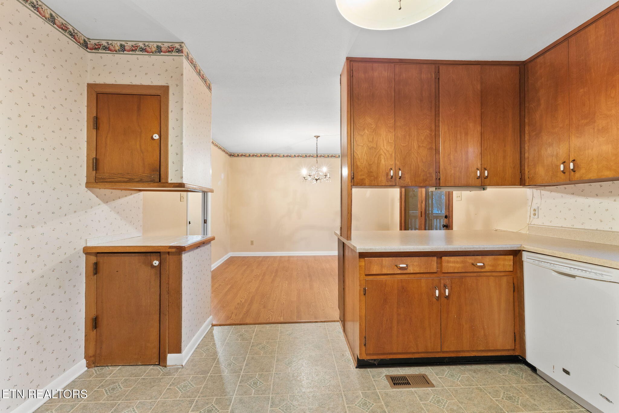 101 Albright Road Oak Ridge, TN 37830 - Photo 15 of 37 a kitchen with a refrigerator and cabinets