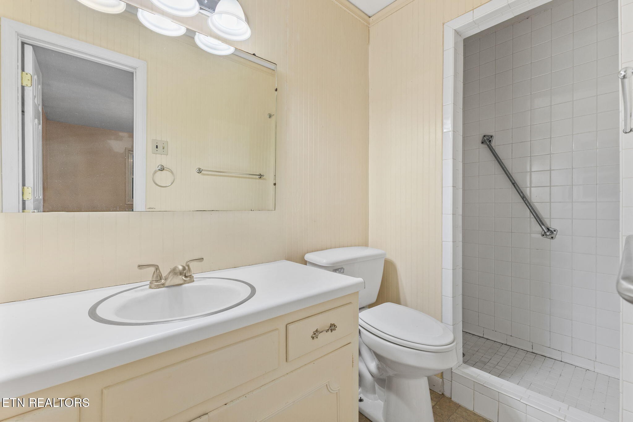 101 Albright Road Oak Ridge, TN 37830 - Photo 18 of 37 a bathroom with a sink a toilet and a mirror
