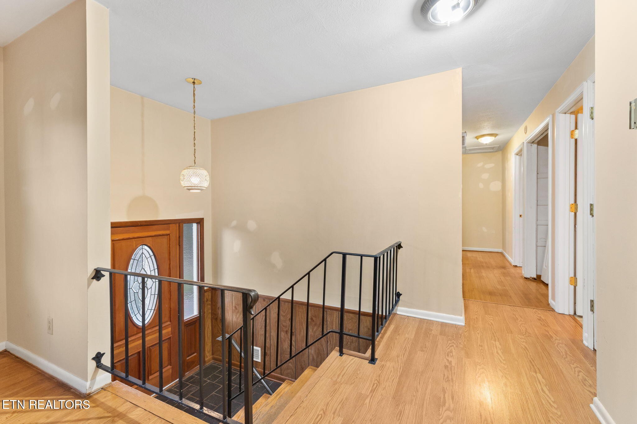 101 Albright Road Oak Ridge, TN 37830 - Photo 7 of 37 a view of a hallway with wooden floor and staircase