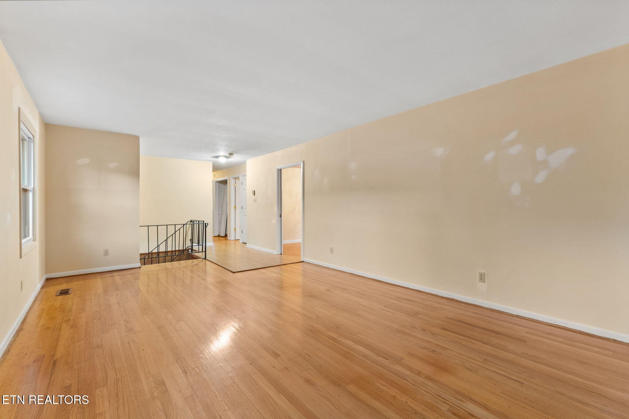 101 Albright Road Oak Ridge, TN 37830 - Photo 9 of 37 a view of an empty room with wooden floor