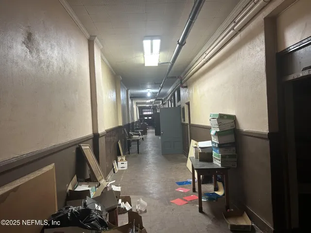 a view of a bathroom with bathtub and window