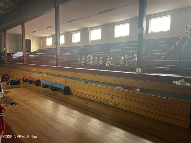 a room with lots of chairs and mirrors