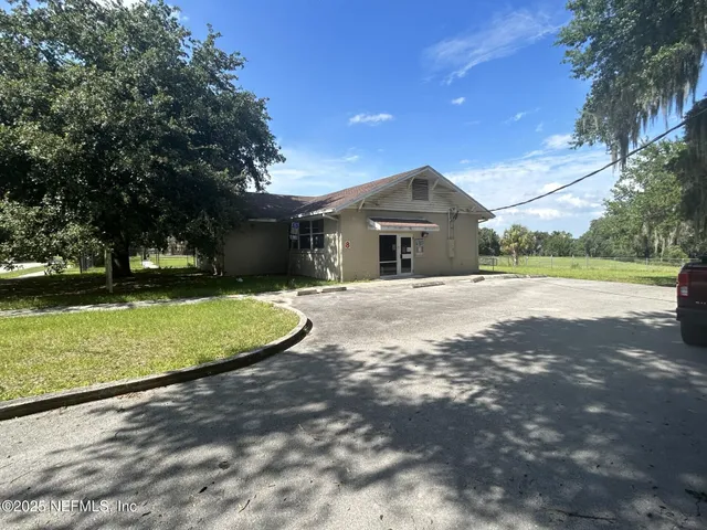 a room with a sink and a mirror