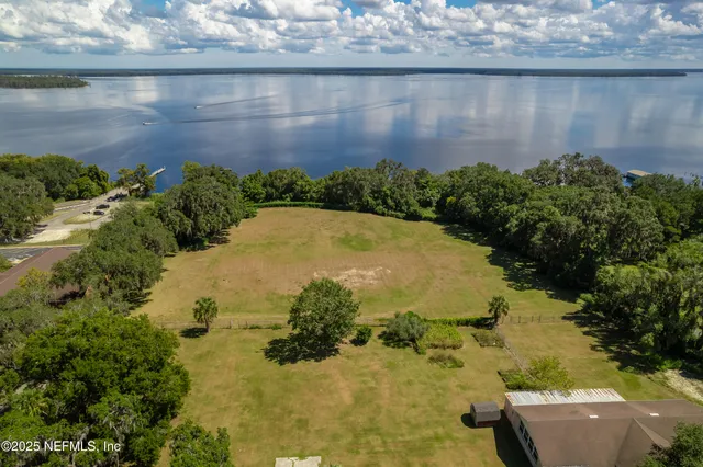 a view of a lake with a building in the background