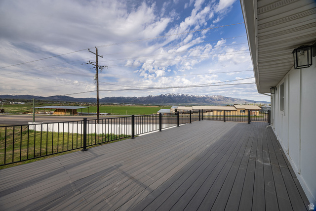 4155 Johnson Road Nibley, UT 84321 - Photo 48 of 71 Wooden deck featuring a yard and a mountain view