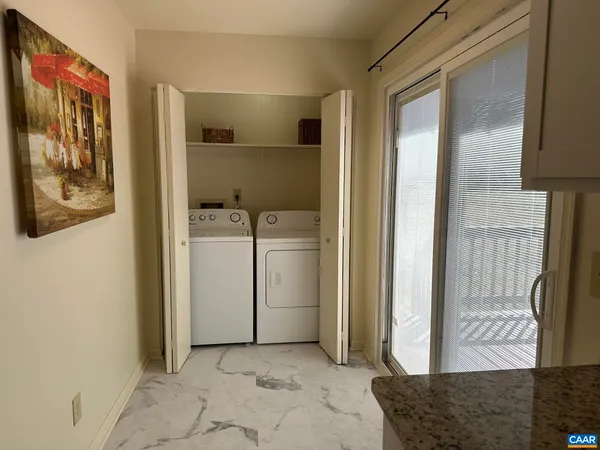 a view of a utility room with closet