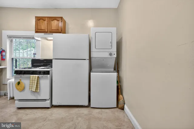 a white refrigerator freezer sitting in a kitchen