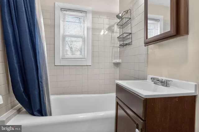 a bathroom with a sink and a bathtub
