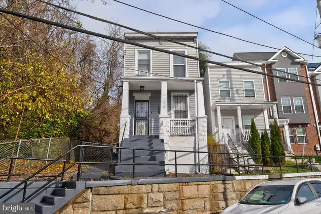 a view of a brick house with a street