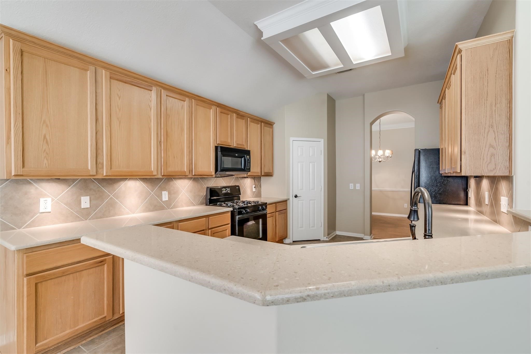 3419 La Fleur Lane Spring, TX 77388 - Photo 11 of 26 a kitchen with stainless steel appliances granite countertop a sink refrigerator and cabinets