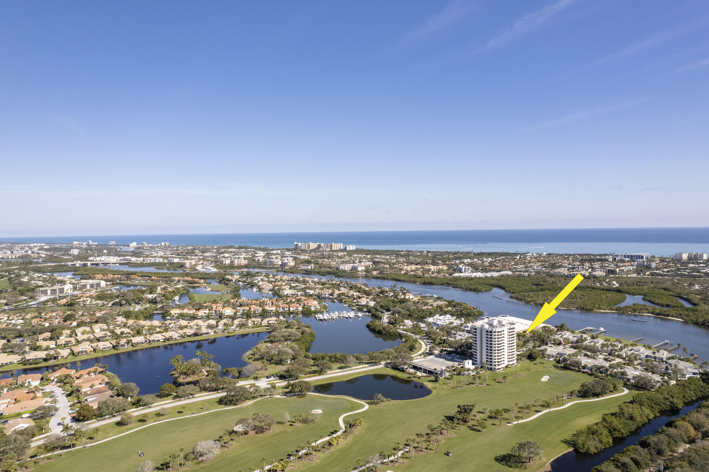 3322 Casseekey Island Road, Unit 504 Jupiter, FL 33477 - Photo 41 of 46 an aerial view of residential houses with outdoor space