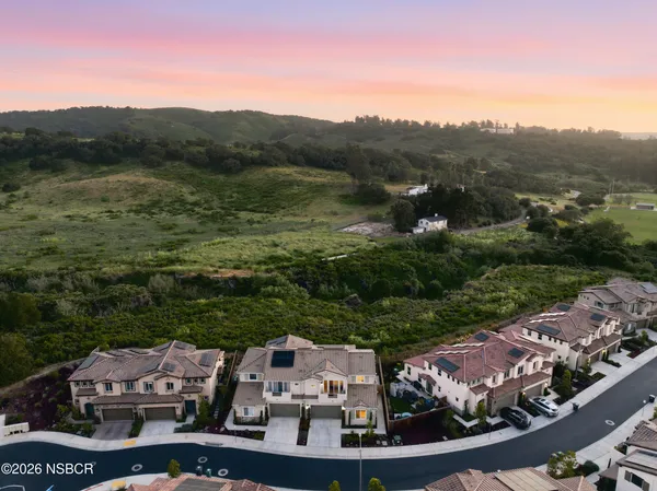 a living room with furniture fireplace and a flat screen tv