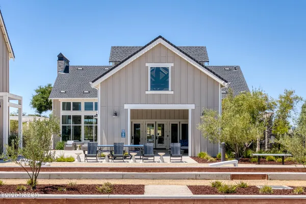 a view of a patio with dining table and chairs
