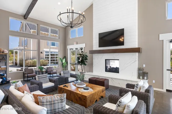 a view of patio with table and chairs and potted plants with wooden fence