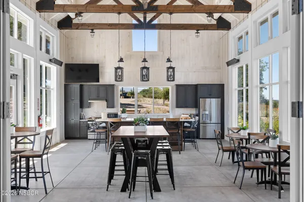 an aerial view of a house with a swimming pool