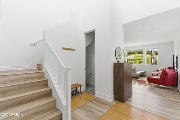 a view of a livingroom with furniture and a window
