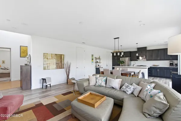 a large kitchen with a table and chairs in it