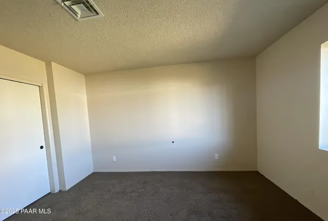 an empty room with a bench