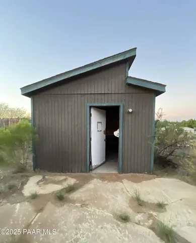 a view of a house with a yard and garage