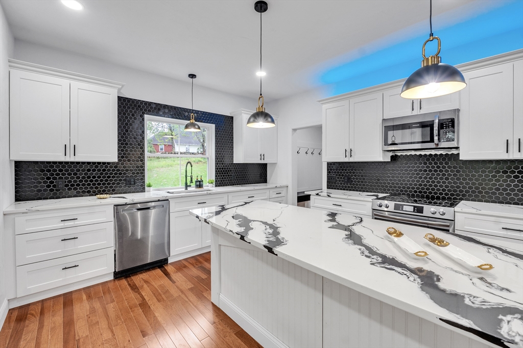 35 Blood Road Charlton, MA 01507 - Photo 19 of 38 a kitchen that has a lot of cabinets in it with granite countertop stainless steel appliances