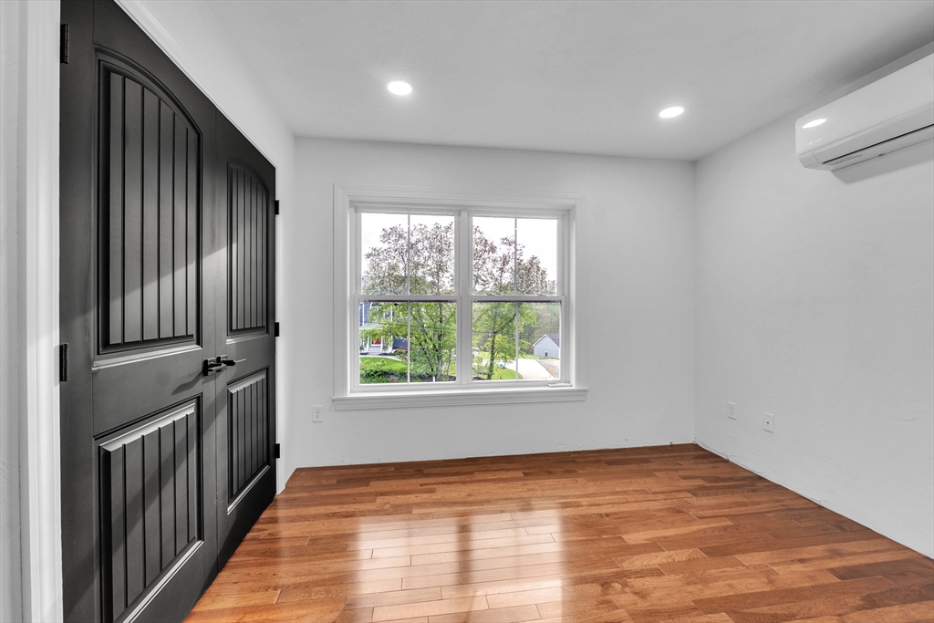 35 Blood Road Charlton, MA 01507 - Photo 27 of 38 a view of an empty room with wooden floor and a window