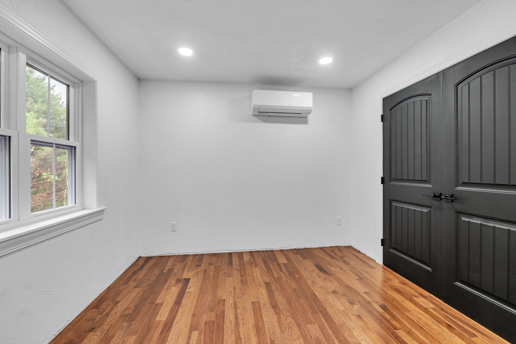 35 Blood Road Charlton, MA 01507 - Photo 30 of 38 a view of empty room with wooden floor and fan