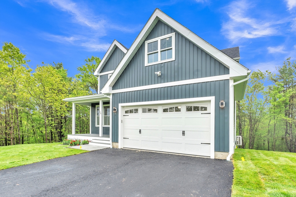 35 Blood Road Charlton, MA 01507 - Photo 3 of 38 a front view of a house with a yard