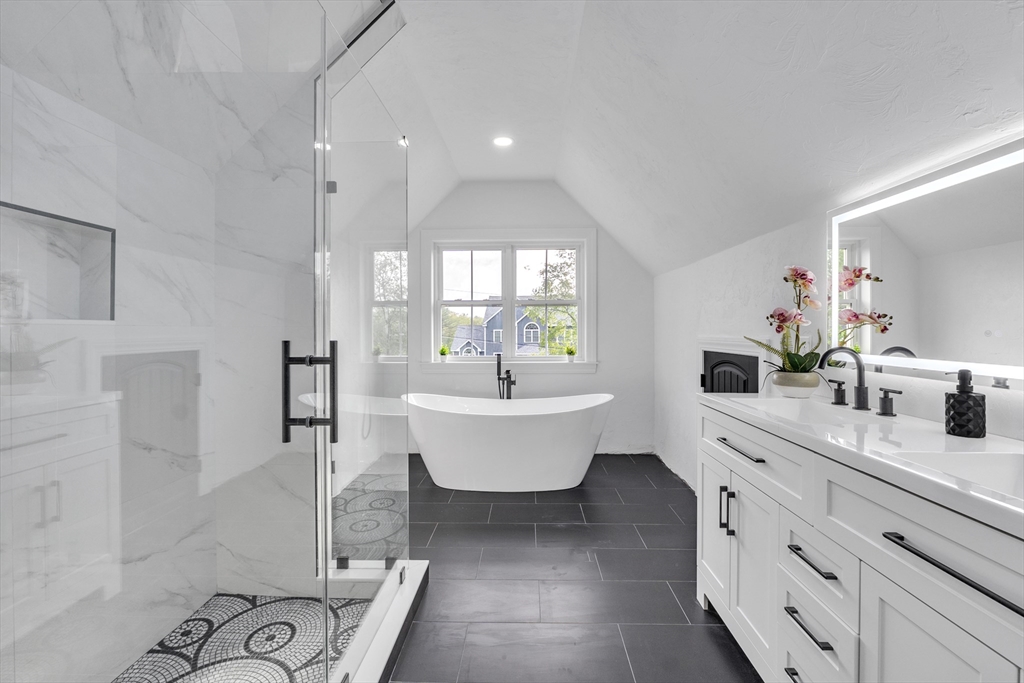 35 Blood Road Charlton, MA 01507 - Photo 32 of 38 a spacious bathroom with a double vanity sink a mirror and a bathtub