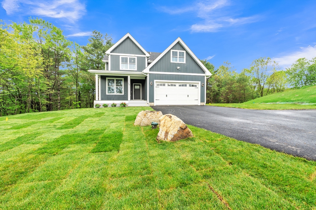 35 Blood Road Charlton, MA 01507 - Photo 35 of 38 a front view of a house with yard