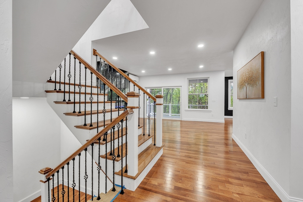35 Blood Road Charlton, MA 01507 - Photo 8 of 38 a view of staircase with lots of frames on wall and wooden floor