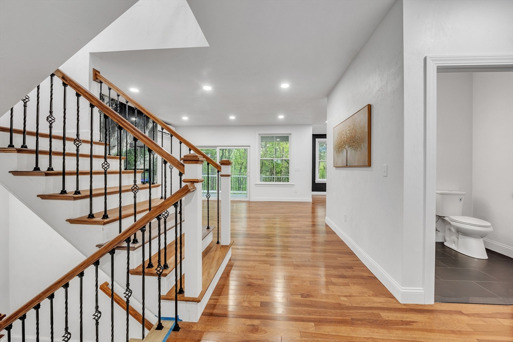 35 Blood Road Charlton, MA 01507 - Photo 9 of 38 a view of a hallway with wooden floor and stairs