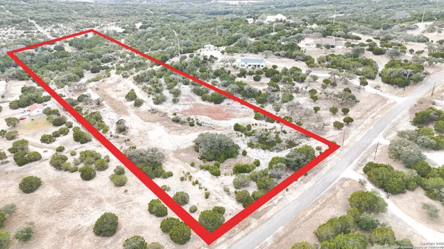 a wooden floor with a book and a wooden bench