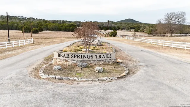 a view of a swimming pool and a yard