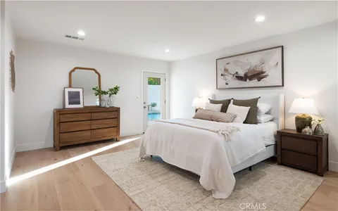 a spacious bathroom with a double vanity sink and a mirror