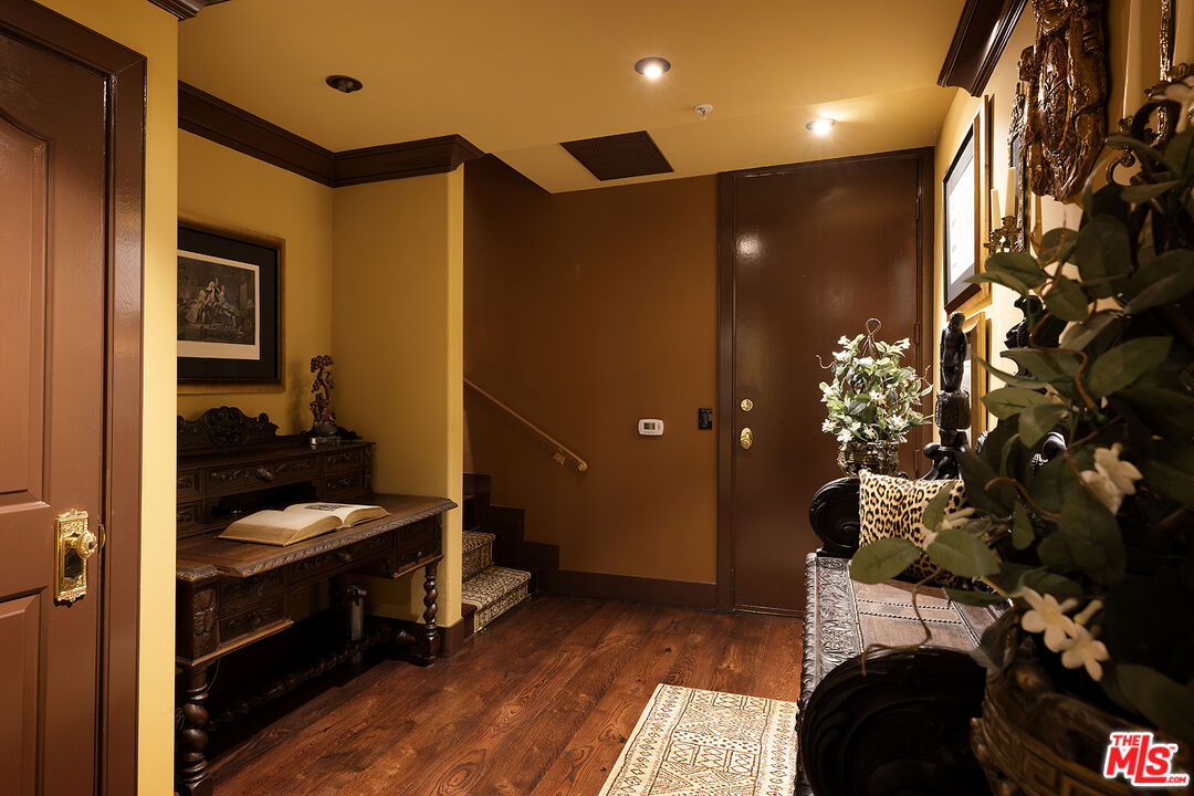 960 North Doheny Drive, Unit 306 West Hollywood, CA 90069 - Photo 16 of 31 a bathroom with a sink and a mirror