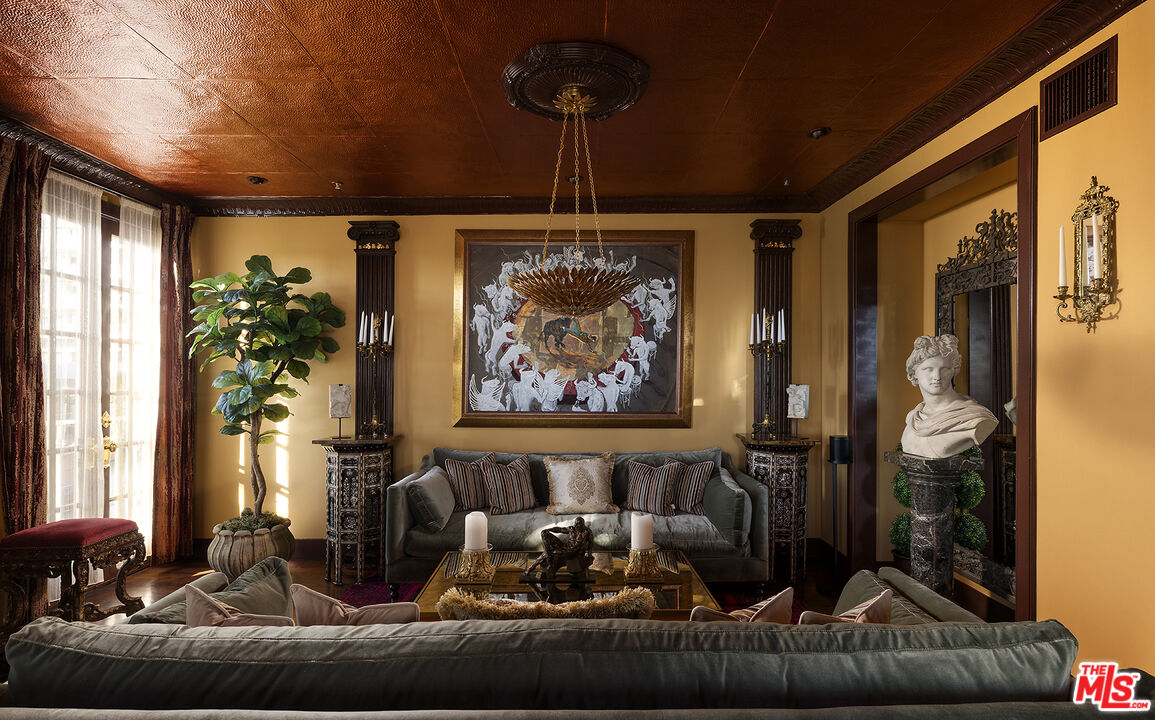 960 North Doheny Drive, Unit 306 West Hollywood, CA 90069 - Photo 2 of 31 a living room with furniture and a potted plant