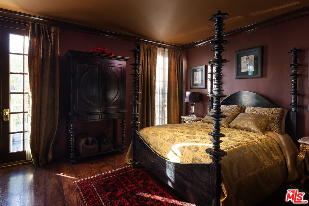 960 North Doheny Drive, Unit 306 West Hollywood, CA 90069 - Photo 23 of 31 a bed sitting in a bedroom next to a window